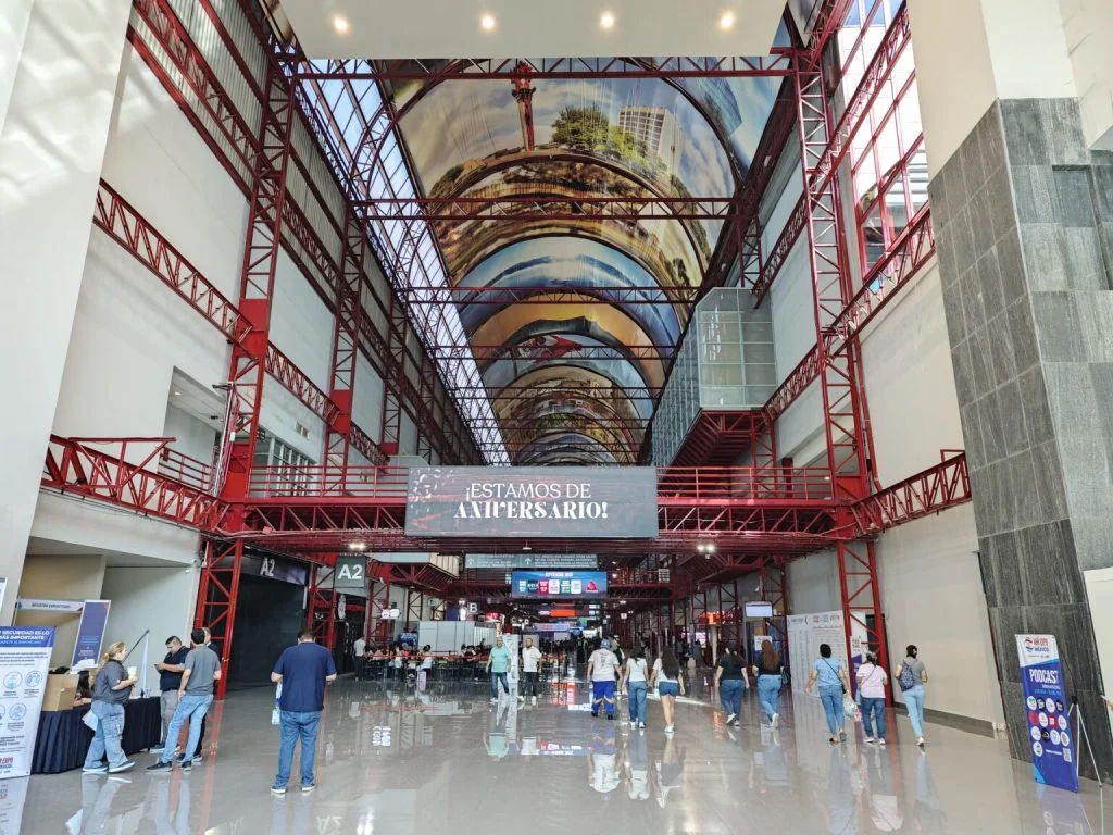 Unveiling Potential – Chic HVAC Group's Unforgettable Impact at AHR 2025 Mexico! 1 ECvents industrial exhibition hall with red steel framework and high ceiling artwork, showcasing a modern event space ideal for trade shows, conferences, and corporate gatherings.